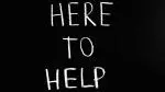 Blackboard with chalked words here to help